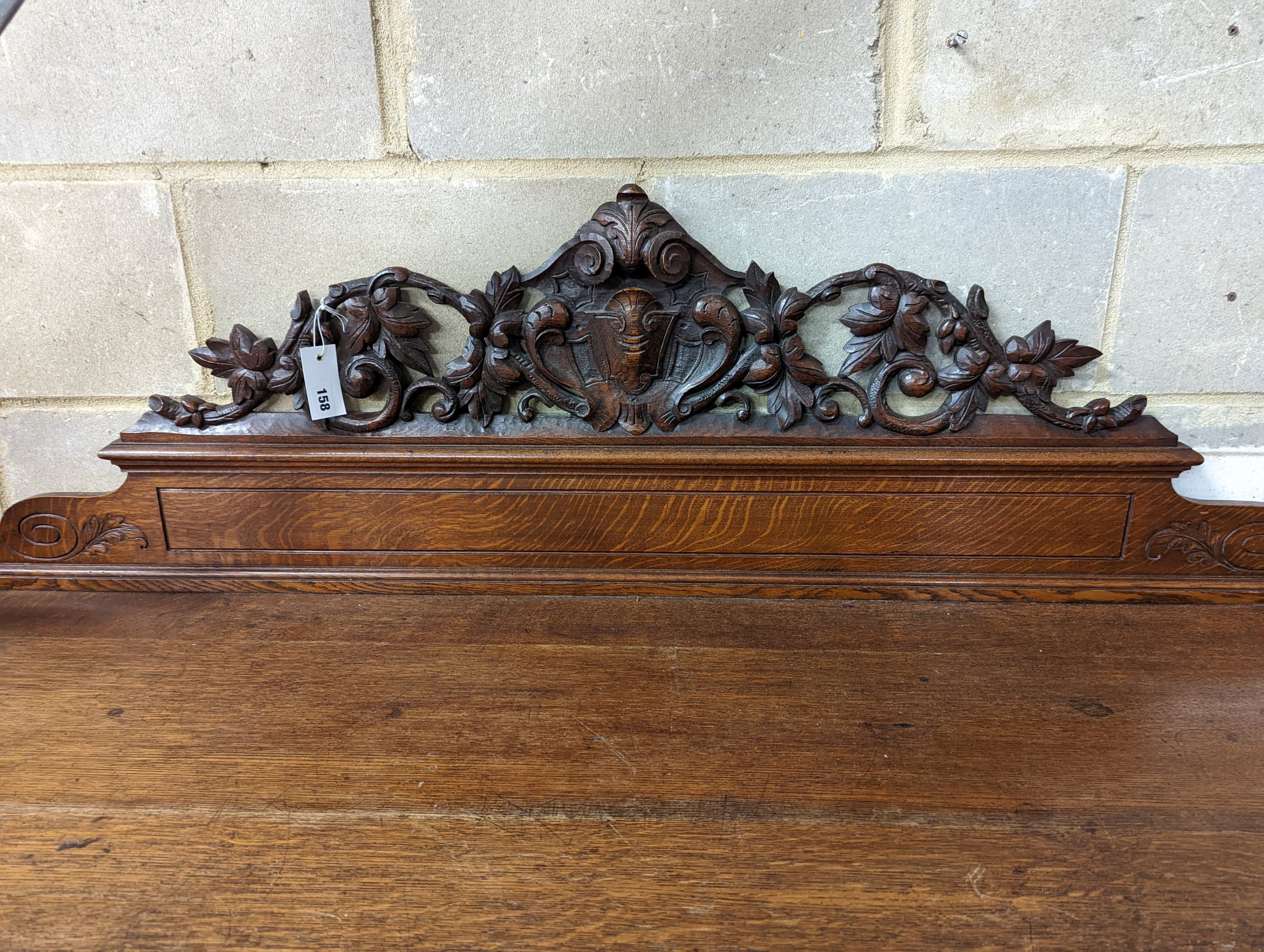 A Victorian oak side cabinet, length 150cm, depth 62cm, height 130cm